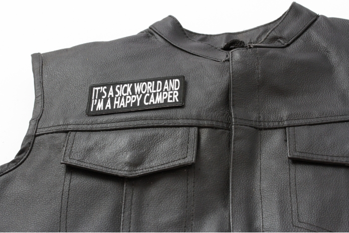 It's A Sick World and I'm A Happy Camper Patch - Iron on Patch - 4x1.75 inch shown on leather vest