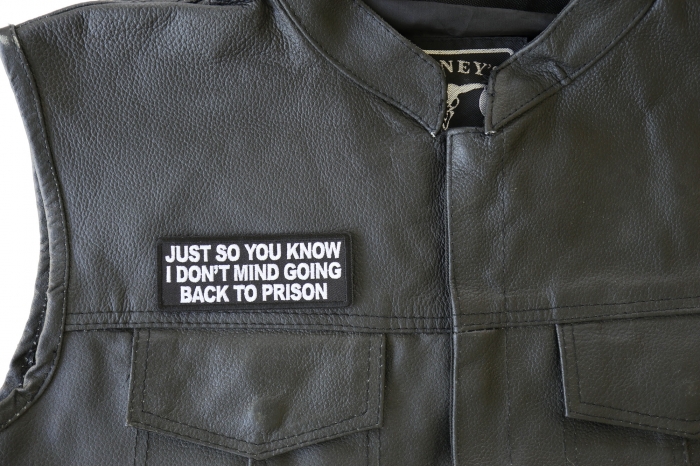 Just So You Know I Don't Mind Going Back to Prison Patch - 4x1.5 inch. Embroidered Iron on Patch shown on leather vest