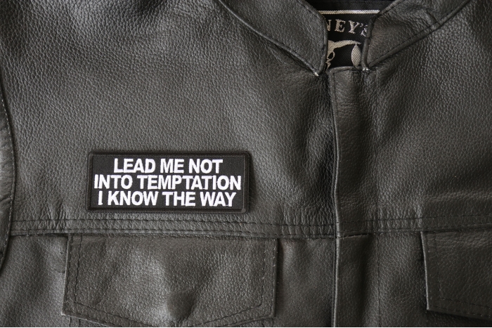 Lead me not into Temptation I know the Way Patch - 4x1.5 inch - Embroidered Iron on Patch shown on leather vest