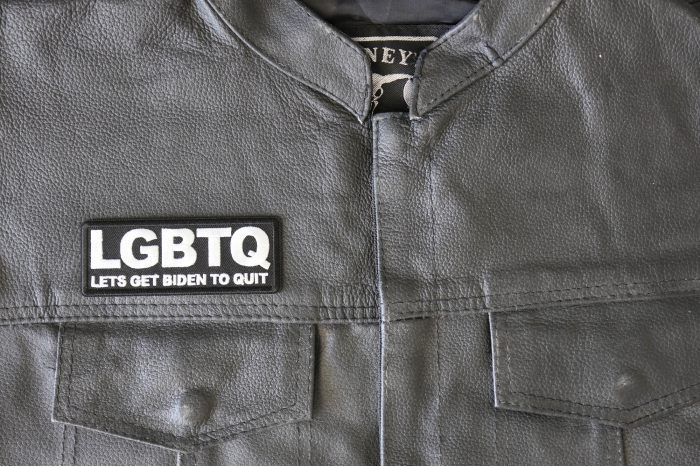 LGBTQ Lets Get Biden to Quit Funny Patch - 4x1.5 inch - Embroidered Iron on Patch shown on leather vest