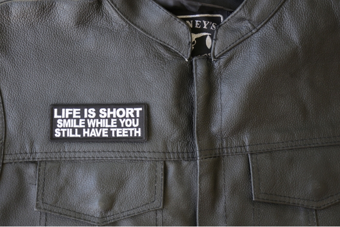 Life is Short Smile While You Still Have Teeth Patch, Funny Saying Patches shown on leather vest