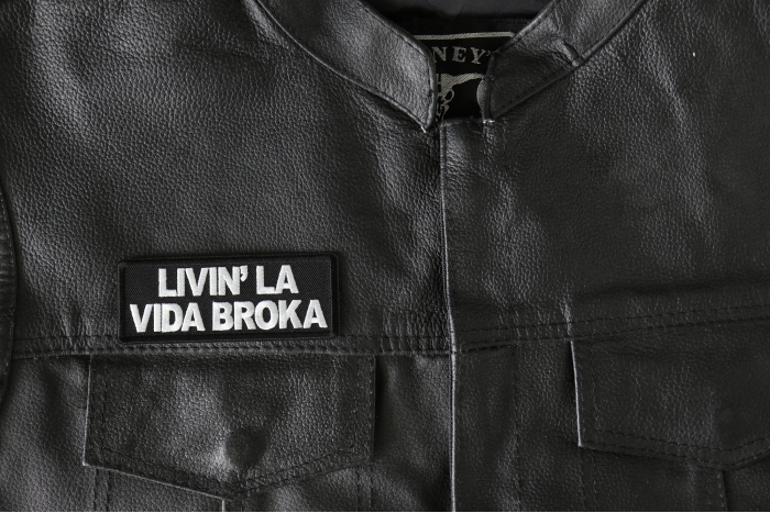 Livin La Vida Broka Patch, Funny Saying Patches, Sew or Iron on Patch shown on leather vest