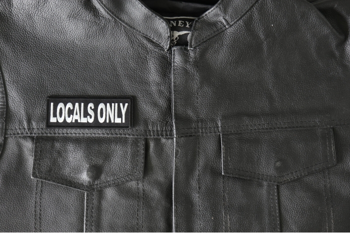 Locals Only Patch - 4x1.5 inch - Embroidered Iron on Patch shown on leather vest