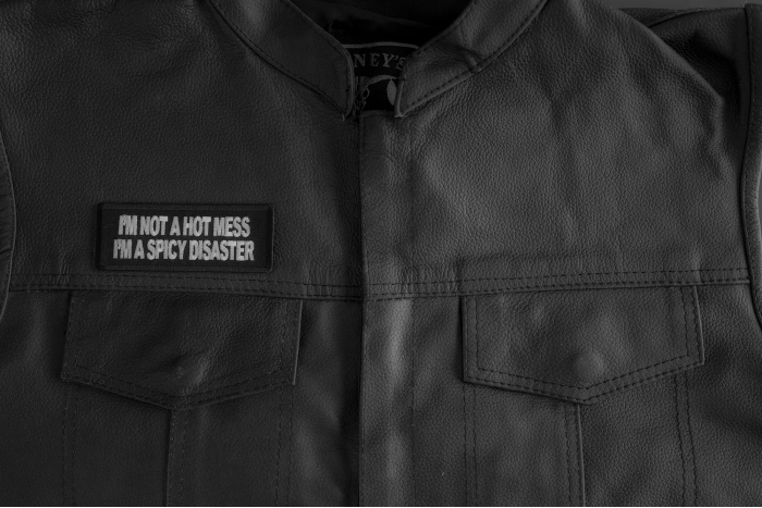 'm Not A Hot Mess Im A Spicy Disaster Patch shown on leather vest