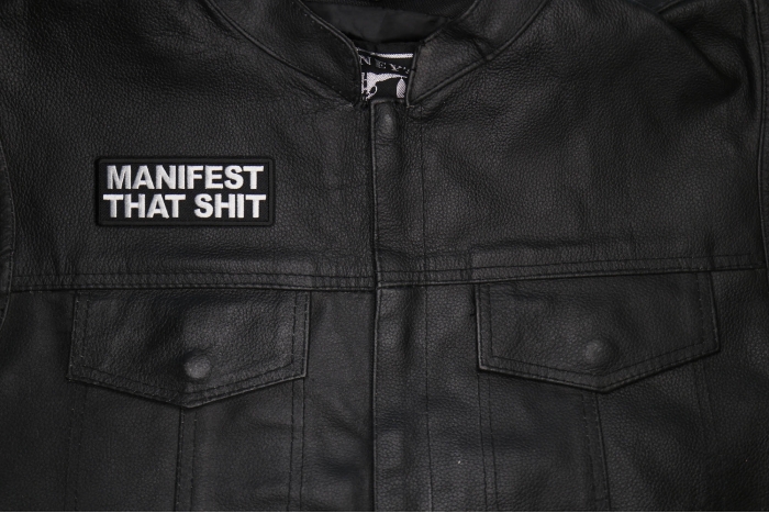 Manifest That Shit Patch shown on leather vest