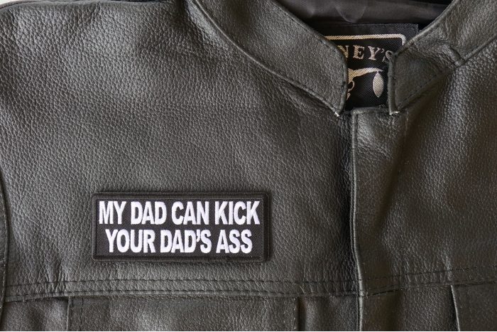 My Dad Can Kick Your Dad's Ass Patch - 4x1.5 inch - Embroidered Iron on Patch shown on leather vest