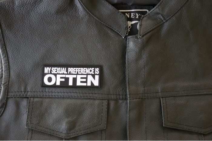 My Sexual Preference is Often Patch - 4x1.5 inch. Embroidered Iron on Patch shown on leather vest