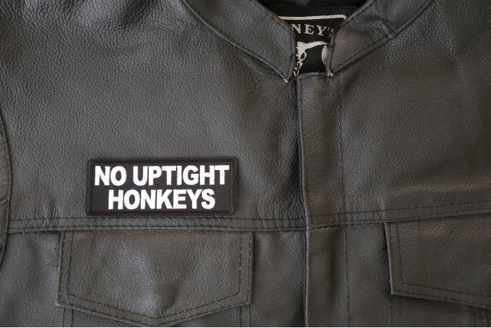 No Uptight Honkeys Patch - 4x1.5 inch - Embroidered Iron on Patch shown on leather vest