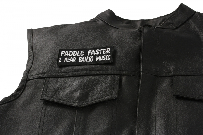 Paddle Faster I Hear Banjo Music Patch - 4x1.5 inch. Embroidered Iron on Patch shown on leather vest