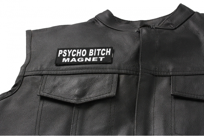 Psycho Bitch Magnet Patch - 4x1.5 inch. Embroidered Iron on Patch shown on leather vest