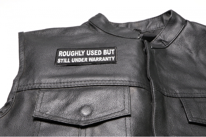 Roughly Used But Still Under Warranty Patch, Funny Saying Patches shown on leather vest