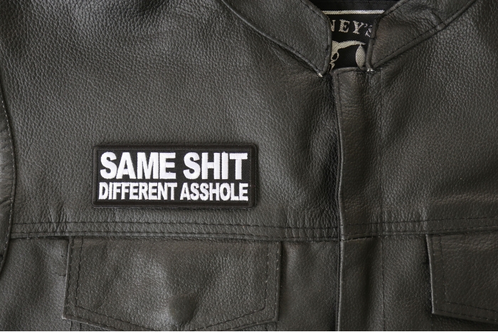 Same Shit Different Asshole Patch - 4x1.5 inch - Embroidered Iron on Patch shown on leather vest