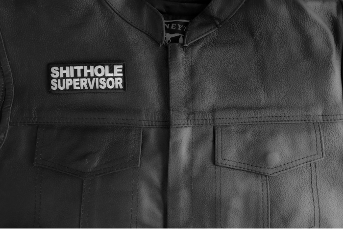 Shithole Supervisor Patch shown on leather vest