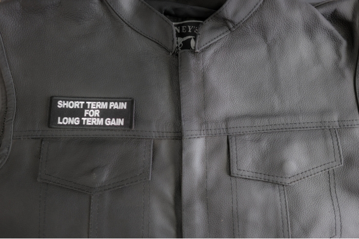 Short Term Pain For Long Term Gain Patch shown on leather vest