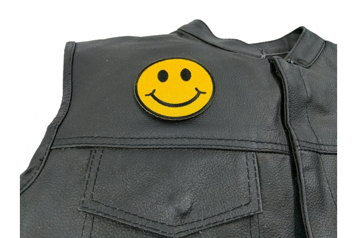 Smiley Face Patch - 3x3 inch. Embroidered Iron on Patch shown on leather vest