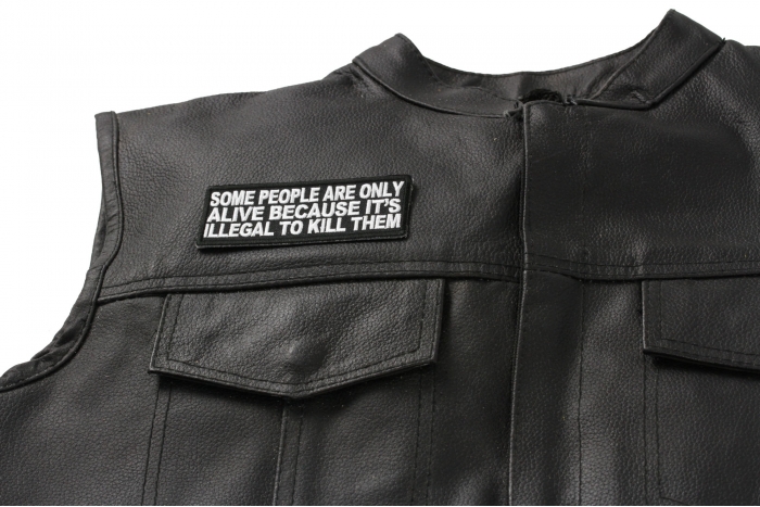 Some People Are Only Alive Patch - 4x1.5 inch. Embroidered Iron on Patch shown on leather vest