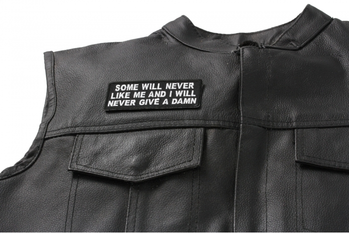 Some Will Never Like Me and I Will Never Give A Damn Patch - 4x1.5 inch. Embroidered Iron on Patch shown on leather vest