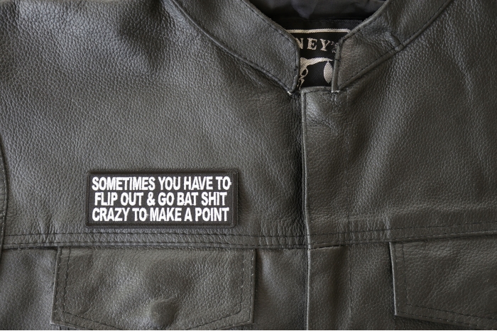 Sometimes You Have to Flip Out and Go Bat Shit Crazy to Make a Point Patch - 4x1.5 inch - Embroidered Iron on Patch shown on leather vest