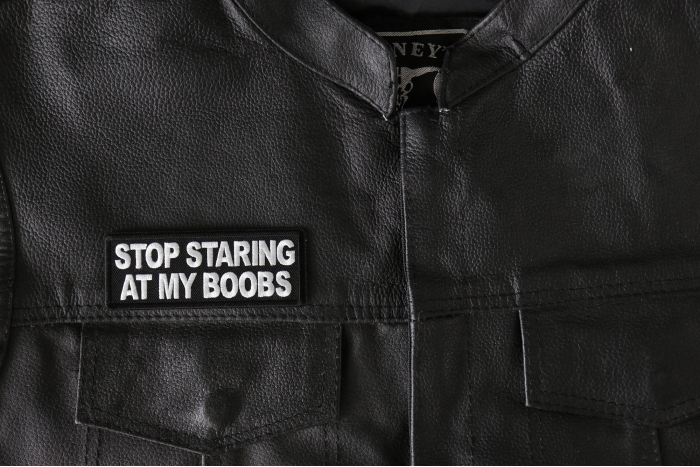 Stop Staring at my Boobs Patch, Saying Patches shown on leather vest