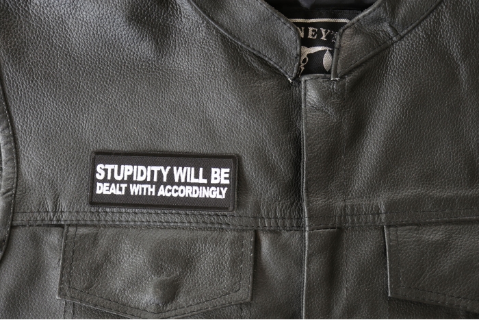 Stupidity will be Dealt with Accordingly Patch - 4x1.5 inch - Embroidered Iron on Patch shown on leather vest