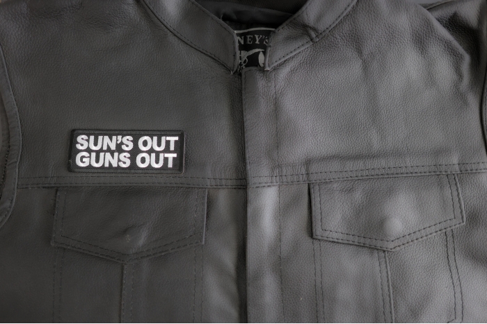 Sun's Out Guns Out Patch shown on leather vest