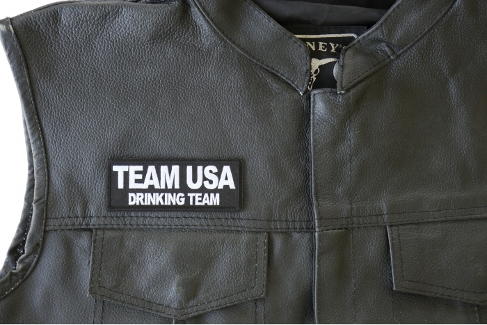Team USA Drinking Team Patch - by Ivamis Trading - 4x1.5 inch - Embroidered Iron on Patch shown on leather vest