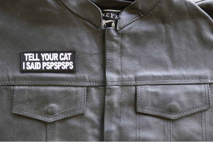 Tell Your Cat I said PSPSPS Iron on Patch shown on leather vest