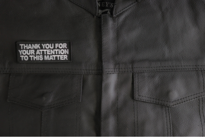 Thank You For Your Attention To This Matter Patch shown on leather vest
