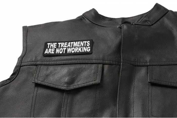 The Treatments Are Not Working Patch - 4x1.5 inch. Embroidered Iron on Patch shown on leather vest