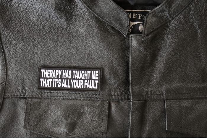 Therapy Has Taught Me That It's All Your Fault Patch - 4x1.5 inch. Embroidered Iron on Patch shown on leather vest