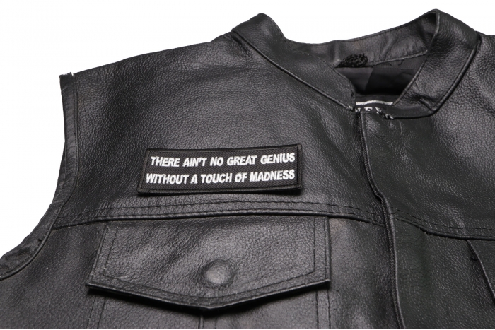 There Ain't No Great Genius Without a Touch of Madness Patch - 4x1.5 inch shown on leather vest