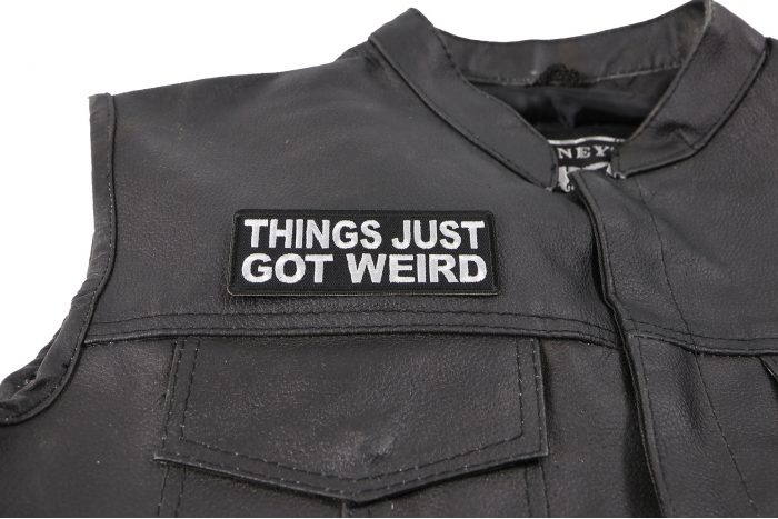 Things Just Got Weird Patch - 4x1.5 inch. Embroidered Iron on Patch shown on leather vest
