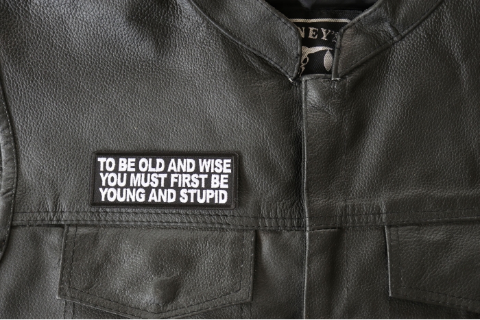To Be Old and Wise You must First be Young and Stupid Patch, Funny Saying Patches shown on leather vest