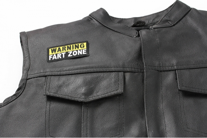 Warning Fart Zone Patch - 3x1.5 inch. Embroidered Iron on Patch shown on leather vest