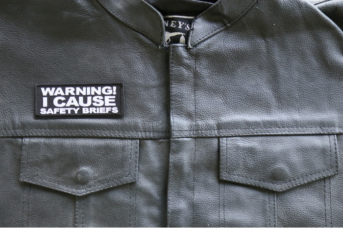 Warning I cause Safety Briefs Patch, Funny Saying Patches shown on leather vest