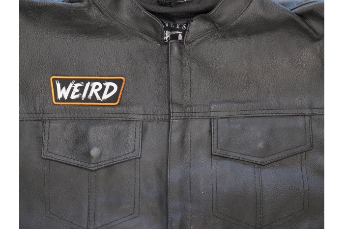 WEIRD Patch shown on leather vest