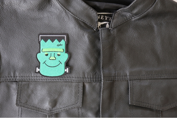 Whacky Frankenstein Patch - 2.8x3.5 inch - Embroidered Iron on Patch shown on leather vest