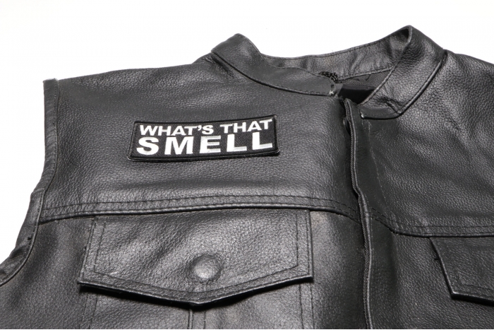 What's That Smell Patch - 4x1.5 inch. Embroidered Iron on Patch shown on leather vest