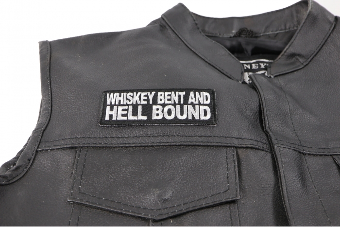 Whiskey Bent and Hell Bound Patch - 4x1.5 inch. Embroidered Iron on Patch shown on leather vest