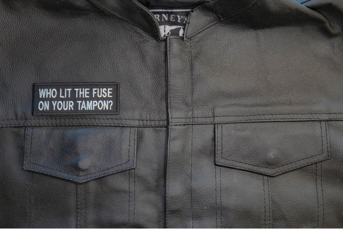 Who Lit The Fuse On Your Tampon Patch - 4x1.75 inch. Embroidered Iron on Patch shown on leather vest