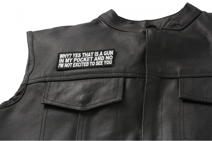Why Yes That Is A Gun In My Pocket and No I'm Not Excited To See You Patch - 4x1.5 in. Embroidered Iron on Patch shown on leather vest