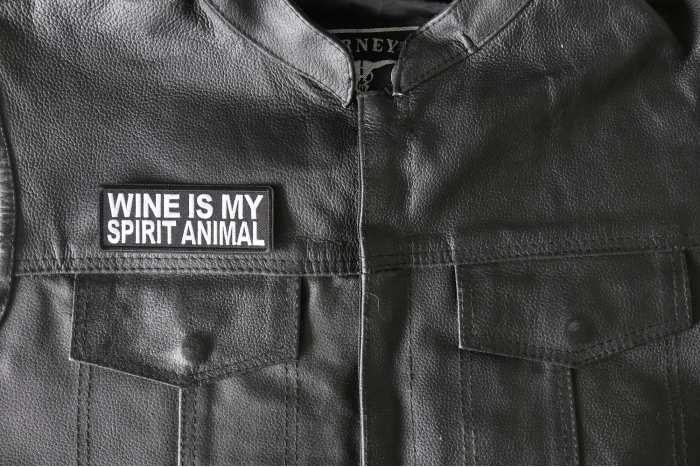 Wine is my Spirit Animal Patch - 4x1.5 inch - Embroidered Iron on Patch shown on leather vest