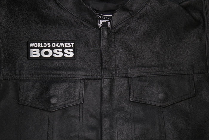 World's Okayest Boss Patch shown on leather vest
