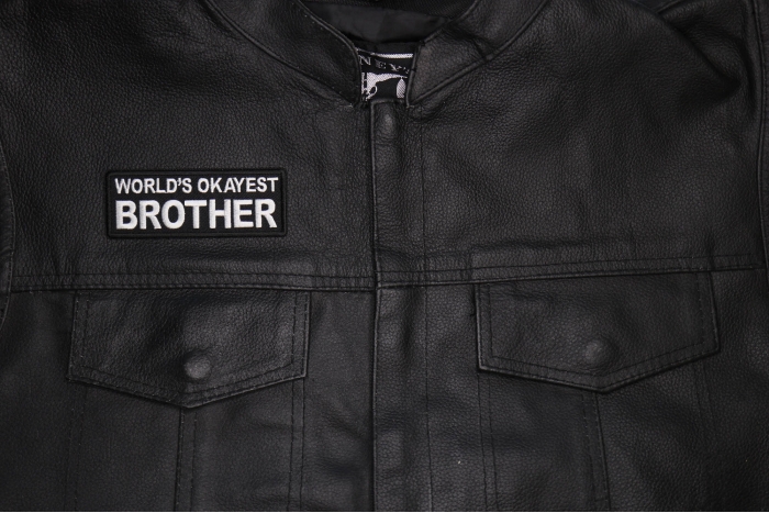 World's Okayest Brother Patch shown on leather vest