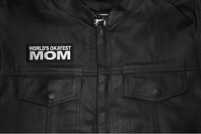 World's Okayest Mom Patch shown on leather vest