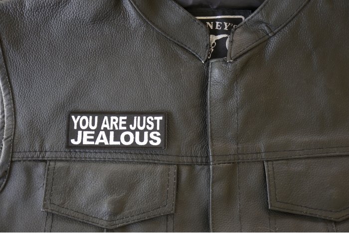 You are Just Jealous Patch - 4x1.5 inch. Embroidered Iron on Patch shown on leather vest