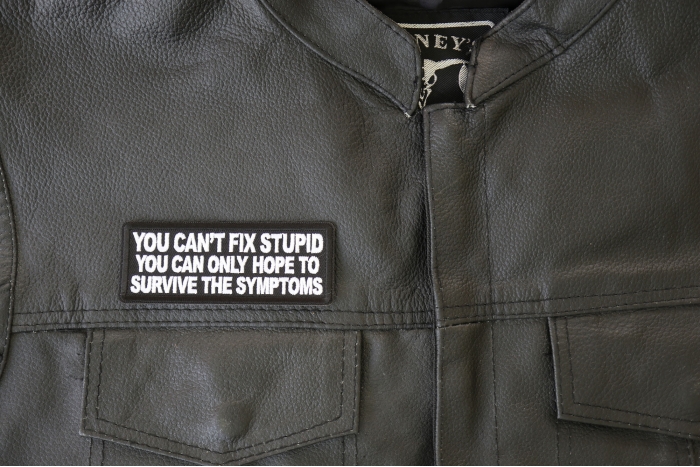 You can't fix stupid you can only hope to survive the symptoms Patch, Funny Saying Patches, Sew or Iron on Patch shown on leather vest