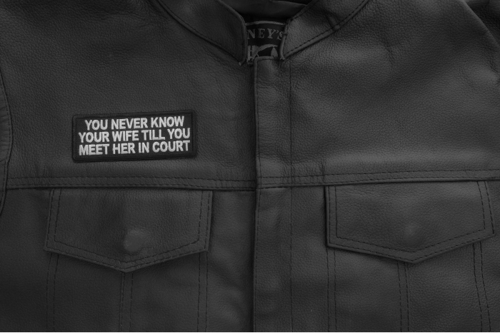 You never know your wife till you meet her in court patch shown on leather vest