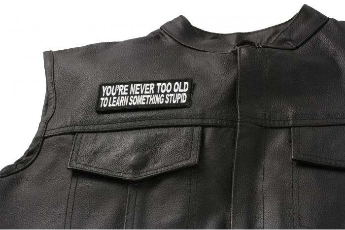 You're Never Too Old To Learn Something Stupid Patch - 4x1.5 inch shown on leather vest