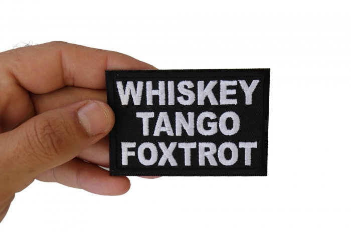 Whiskey Tango Foxtrot WTF Patch shown on hand for size comparison